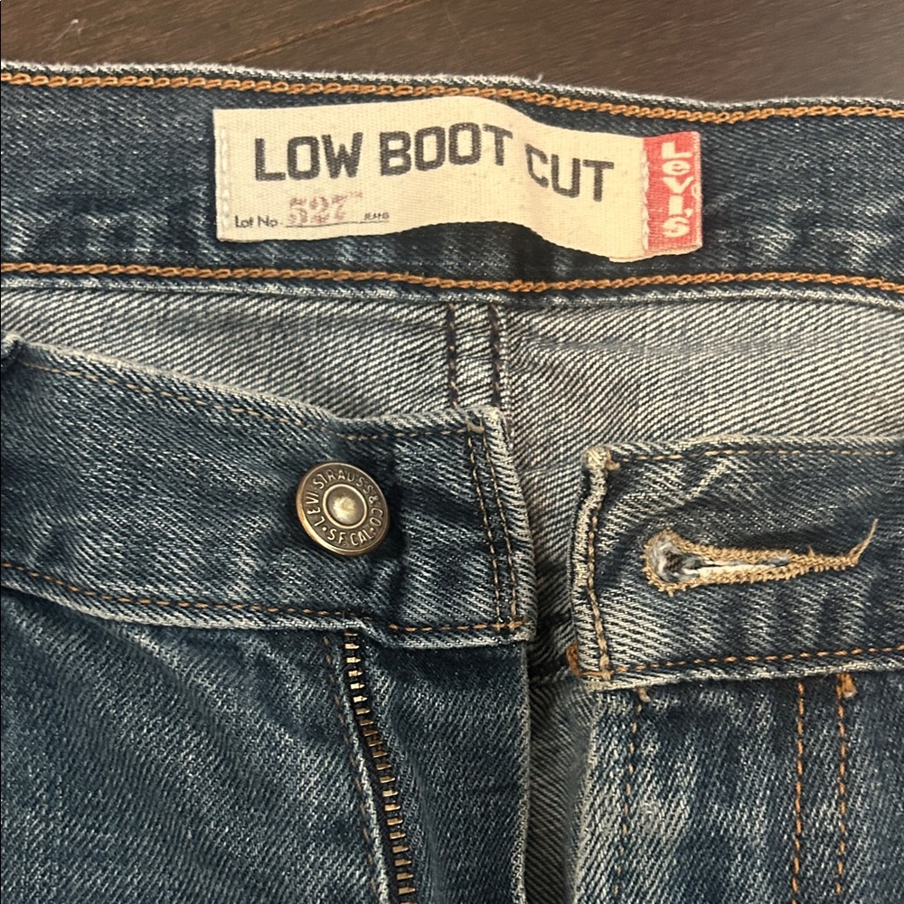 Levi's Denim Low-Rise Boot Cut Jeans in Medium Blue